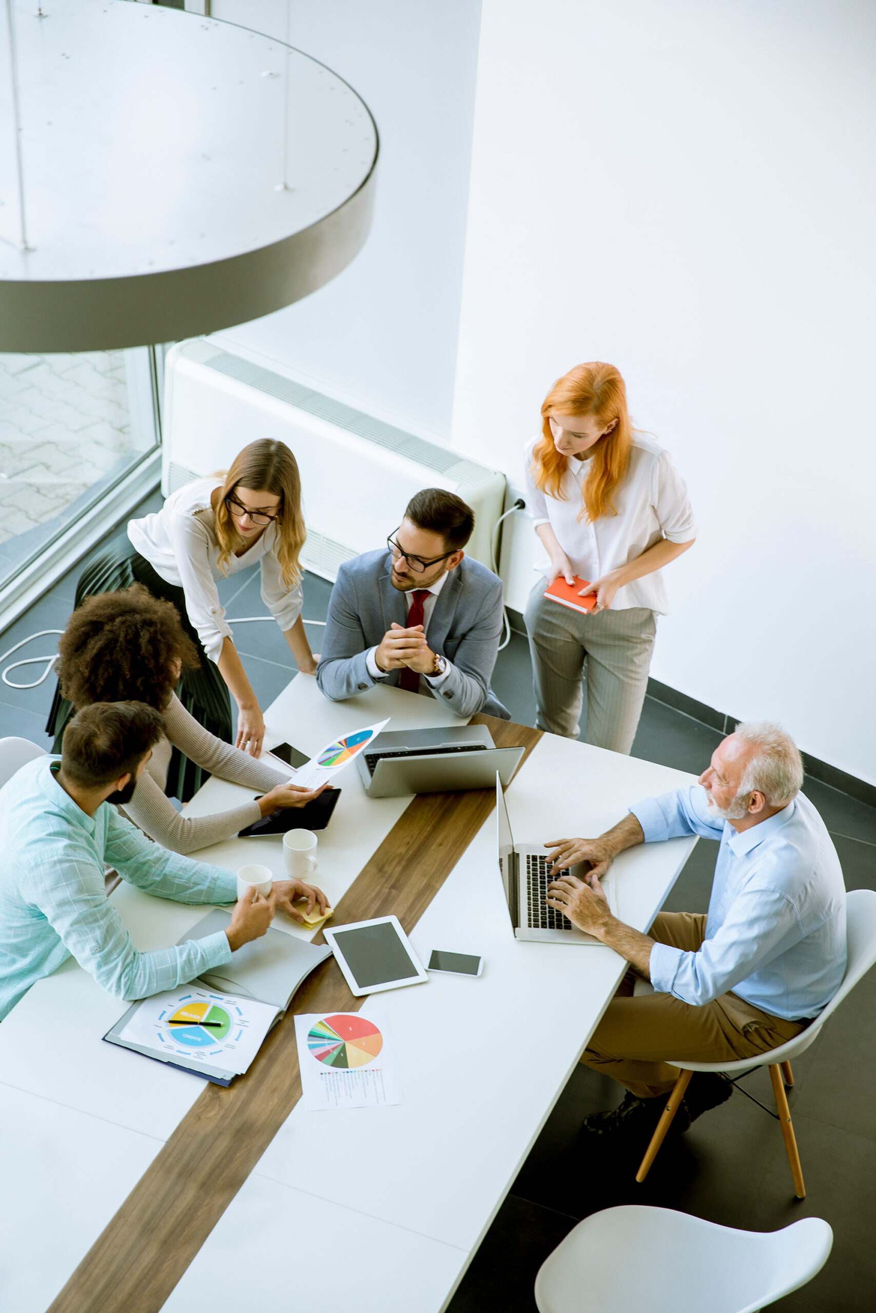 Top view at business people in office Top view at business people working in office